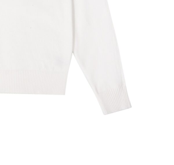 Prada's exquisite crew-neck sweater is a premium wool blend knitwear piece for women